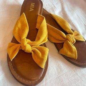 Yellow slide on sandals